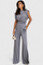 Asymmetrical Set with Draped Shoulders and Flared Pants in Light Gray