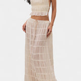 Halter Neck Pleated Ensemble with Flowing High-Waisted Skirt