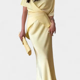 Two-Piece Ensemble with Crisscross Straps and Flowing Skirt in Yellow