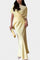 Two-Piece Ensemble with Crisscross Straps and Flowing Skirt in Yellow