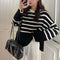 Lieselotte Cable-Knit Turtleneck Sweater in Black