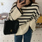 Lieselotte Cable-Knit Turtleneck Sweater in Cream