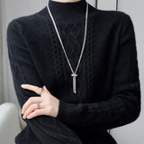 Reinhild Cable-Knit Turtleneck Sweater in Black